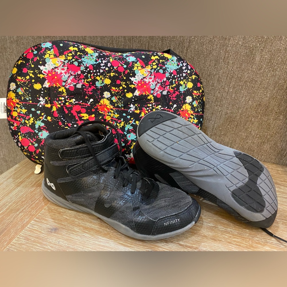 Nfinity midnight beast midtop cheer shoes with carry case.